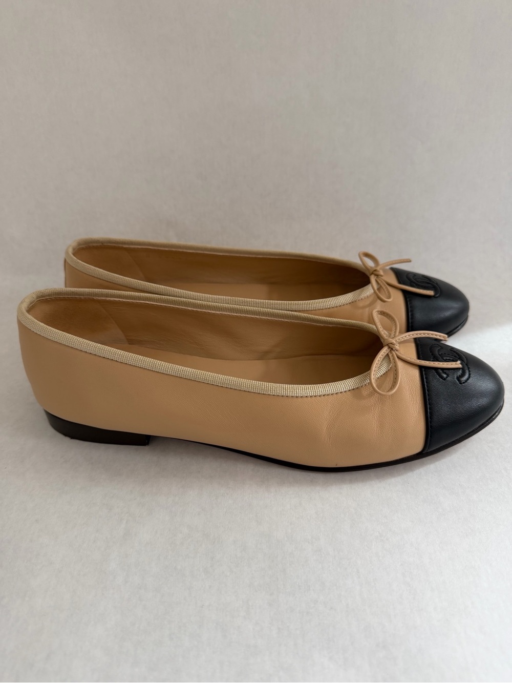 CHANEL Beige and Black Cap-Toe Ballet Flats with CC Logo